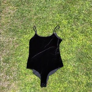Black bodysuit. Really cute.